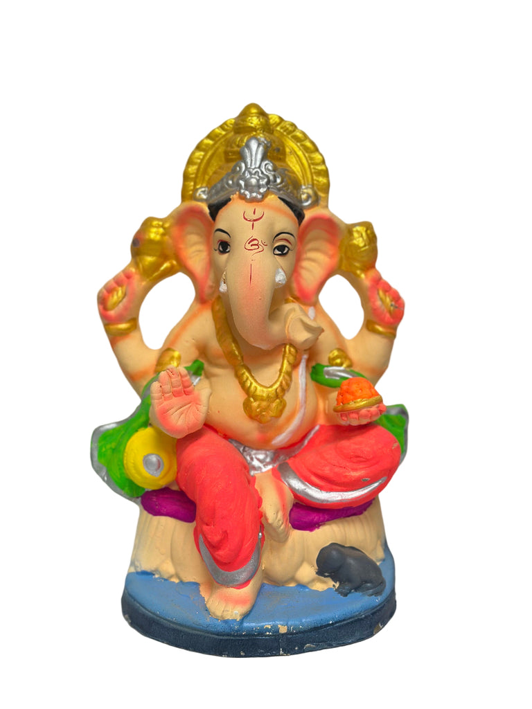 Colorful statue of a deity with intricate details on a white background