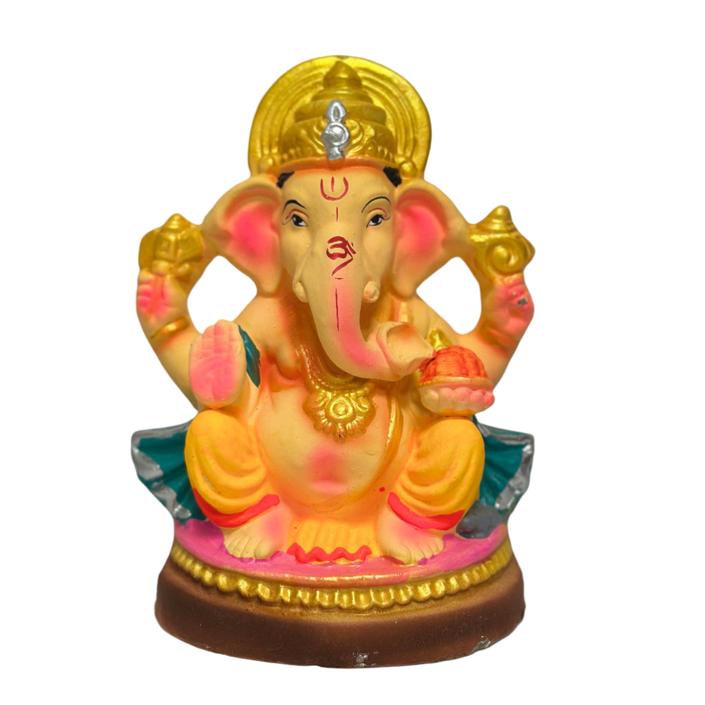 Colorful statue of a deity with a gold head on a gray background